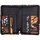 An open zippered passport holder case with black interior lining and butterfly-wing patterned exterior panels.