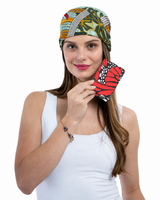 A woman  holding a slim passport holder featuring a printed monarch butterfly wing pattern.