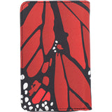 A slim passport holder featuring a printed monarch butterfly wing pattern.