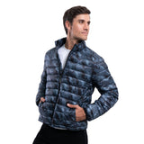 Man wearing a blue patterned puffer jacket on a white background