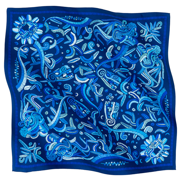 Blue scarf with white abstract patterns on a white background