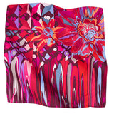 A square silk scarf featuring a vibrant, multicolored abstract floral and geometric print.