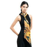 Woman wearing a black sleeveless top with a colorful scarf around her neck