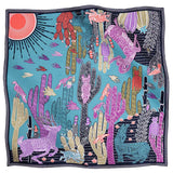 A square silk scarf featuring a vibrant desert inspired pattern.