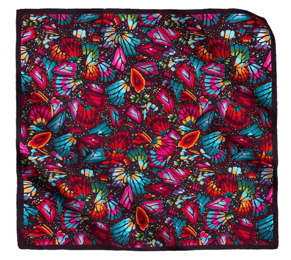 Colorful butterfly patterned silk scarve on a white background